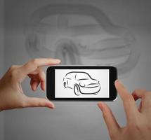 Smart hand using touch screen phone take photo of  Car icon as concept