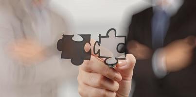 businessman hand showing  puzzle partnership sign as concept photo