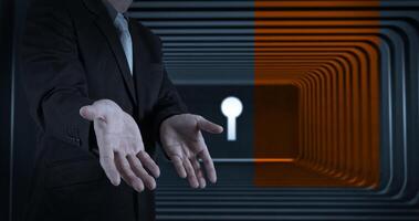 businessman open hands to a gate shaped like a keyhole photo