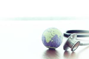 Studio macro of a stethoscope and texture globe with shallow DOF evenly matched abstract as medical network concept Elements of this image furnished by NASA photo