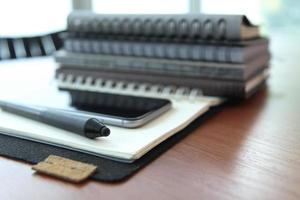 Office workplace with laptop and smartphone on wood table photo