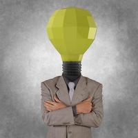 businessman with low polygonal 3d light bulb head concept symbol photo