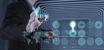 businessman hand showing search engine optimization SEO photo