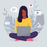 a freelancer is sitting at a laptop. A young girl is sitting in the lotus position. A black girl. Vector illustration in flat styles