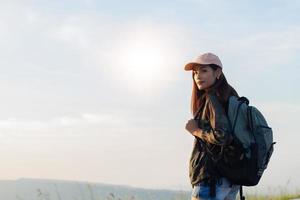 Asian  young women people Hiking with friends backpacks walking together and looking map and taking photo camera by the road and looking happy ,Relax time on holiday concept travel