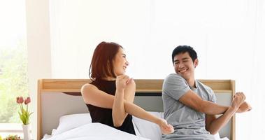 Asian couples lover waking up in her bed fully rested in morning photo