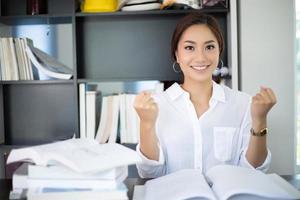 Asian business woman arms up for Celebration Success Working ,Successful Concept photo