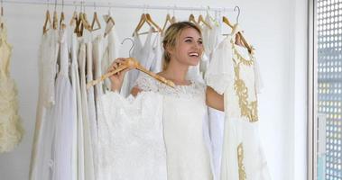 The lovers give flowers to the bride and kissed happy and couple love standing in wedding studio photo