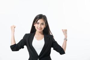 Asian business women are smiling and Thump up hand sign for working happy and Success and winning concept on white background photo