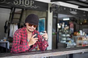 Man asian using phone and credit card shopping online photo