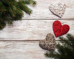 Christmas tree branches with heart decoration photo