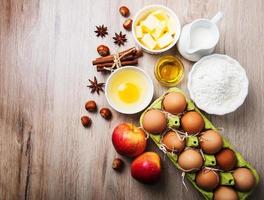 Top view of  kitchen table with baking ingredients photo