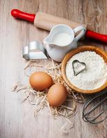 Baking ingredients - flour, eggs and pin photo