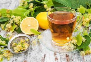 cup of herbal tea with linden flowers photo