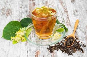 cup of herbal tea with linden flowers photo