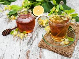 cup of herbal tea with linden flowers photo