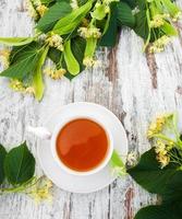 cup of herbal tea with linden flowers photo