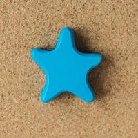 Decorative starfish on a sand photo