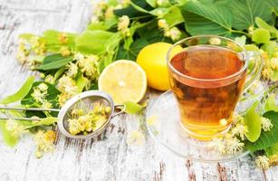 cup of herbal tea with linden flowers photo