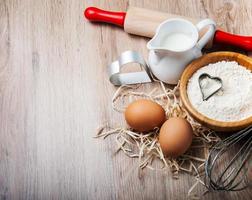 Baking ingredients - flour, eggs and pin photo