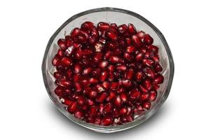 red pomegranate seeds in a glass vase