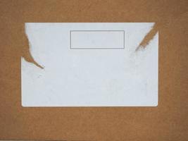 brown cardboard with white label photo