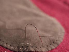 patch sewing with selective focus on needle photo