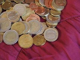 Euro coins, European Union over red velvet background photo