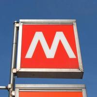 Subway sign over blue sky photo