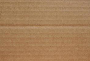 Fondo de textura de cartón corrugado marrón grunge foto