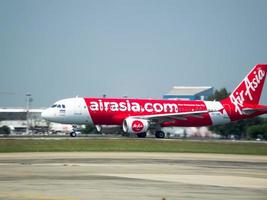 Don Muang BANGKOK THAILAND12 JANUARY 2019The aircraft of AirAsia Airlines is takeoff from Don Mueang Airport.on Don Muang BANGKOK THAILAND12 JANUARY 2019. photo