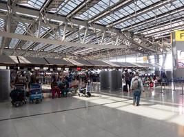 Suvarnabhumi BANGKOK THAILAND31 OCTOBER 2018In the airport passengers are walking to different areas of the airport. Suvarnabhumi Airport is Thailands main airport.0n BANGKOK THAILAND. photo