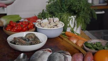 Various seafoods on chef kitchen. video