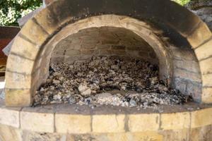 Burning firewood in a furnace, embers, glowing coals. photo