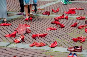 Bergamo Itali 17 May 2013 Red shoes to denounce violence against women photo