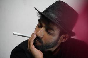 young actor preparing for his act wearing directors cap photo