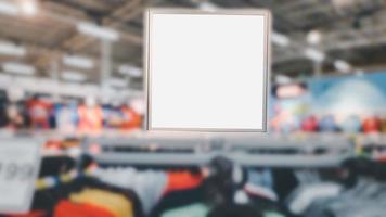 Billboard and white blank screen in blurry at shopping or department store background. Mockup shopping. photo