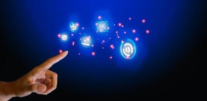 Finger touching on interface diagram and business icon on blue background. Connection of technology and innovation, machine learning. Technology and science concept. photo