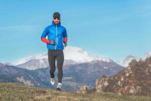 Marathon runner during winter training in altitude photo