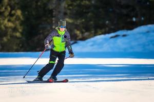 Skier while practicing technical ski exercises photo