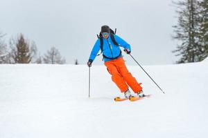 Downhill ski mountaineering photo