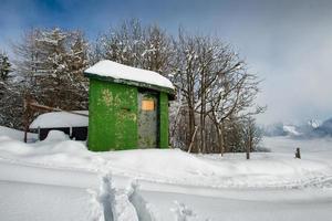 Hunting cabin in the snow photo