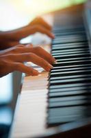 Pianist hands on the keyboard photo