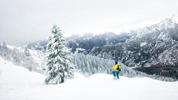 Winter landscape in a solitary snowshoeing on the Alps photo