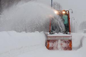 Snowplow in swiss alps photo