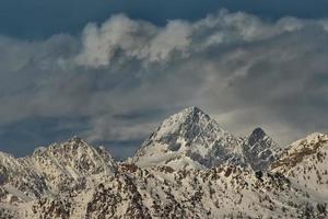 Snow covered mountain top. photo