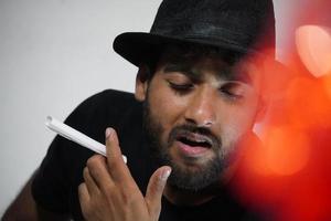 young actor preparing for his act wearing directors cap photo