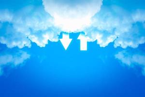Cloud data storage concept. White cloud and arrow on blue sky background with copyspace. Communication of business and financial. Transfer data to storage. photo