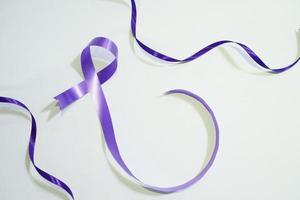 purple ribbon with white background for world cancer day photo