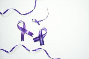 purple ribbon with white background for world cancer day photo